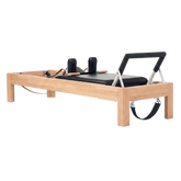 Pilates Reformer in solid beech wood - pilates studio and home studio equipment by Consta Pilates Equipment.