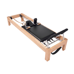 Pilates Reformer in solid beech wood - pilates studio and home studio equipment by Consta Pilates Equipment.