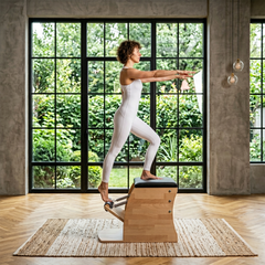 Pilates Wunda Chair in solid beech wood - pilates studio and home studio equipment by Consta Pilates Equipment.