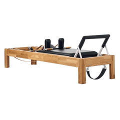 Pilates Reformer in solid oak wood - pilates studio and home studio equipment by Consta Pilates Equipment.