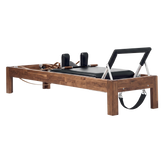 Solid Walnut Reformer, premium boutique pilates studio equipment by Consta Pilates Equipment.