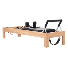 Pilates Reformer in solid beech wood - pilates studio and home studio equipment by Consta Pilates Equipment.