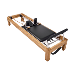 Pilates Reformer in solid oak wood - pilates studio and home studio equipment by Consta Pilates Equipment.