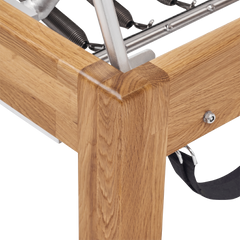 Pilates Reformer in solid oak wood - pilates studio and home studio equipment by Consta Pilates Equipment.