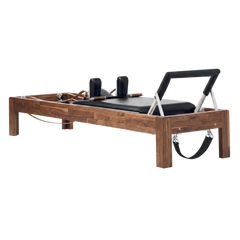 Solid Walnut Reformer, premium boutique pilates studio equipment by Consta Pilates Equipment.